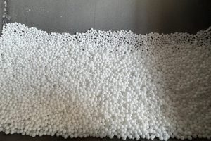 What effect does the size of a high alumina ball have on performance?